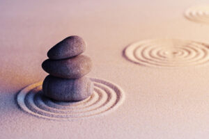 Zen,Garden,Stones,On,Sand,With,Ornament